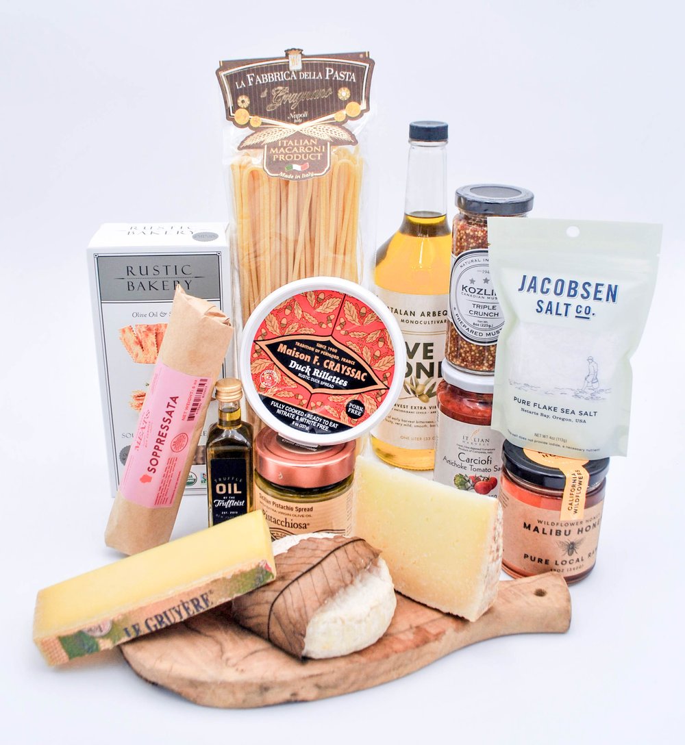 The Gourmand gift basket with cheese, honey, mustard, sauce, pasta, crackers, salami, olive oil, pistachio spread, truffle oil, sea salt